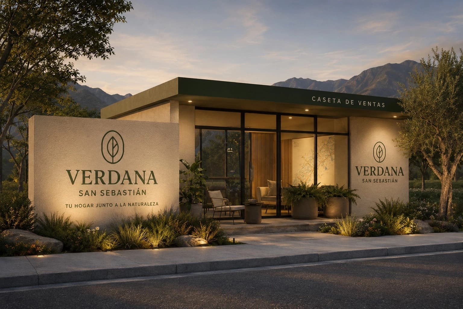 Caseta de ventas de Verdana San Sebastián al atardecer, con la barda de piedra grabada con el emblema y la sierra al fondo